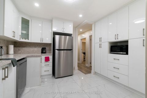 Photo 2 at 19 Treverton Drive, Kennedy Park, Toronto